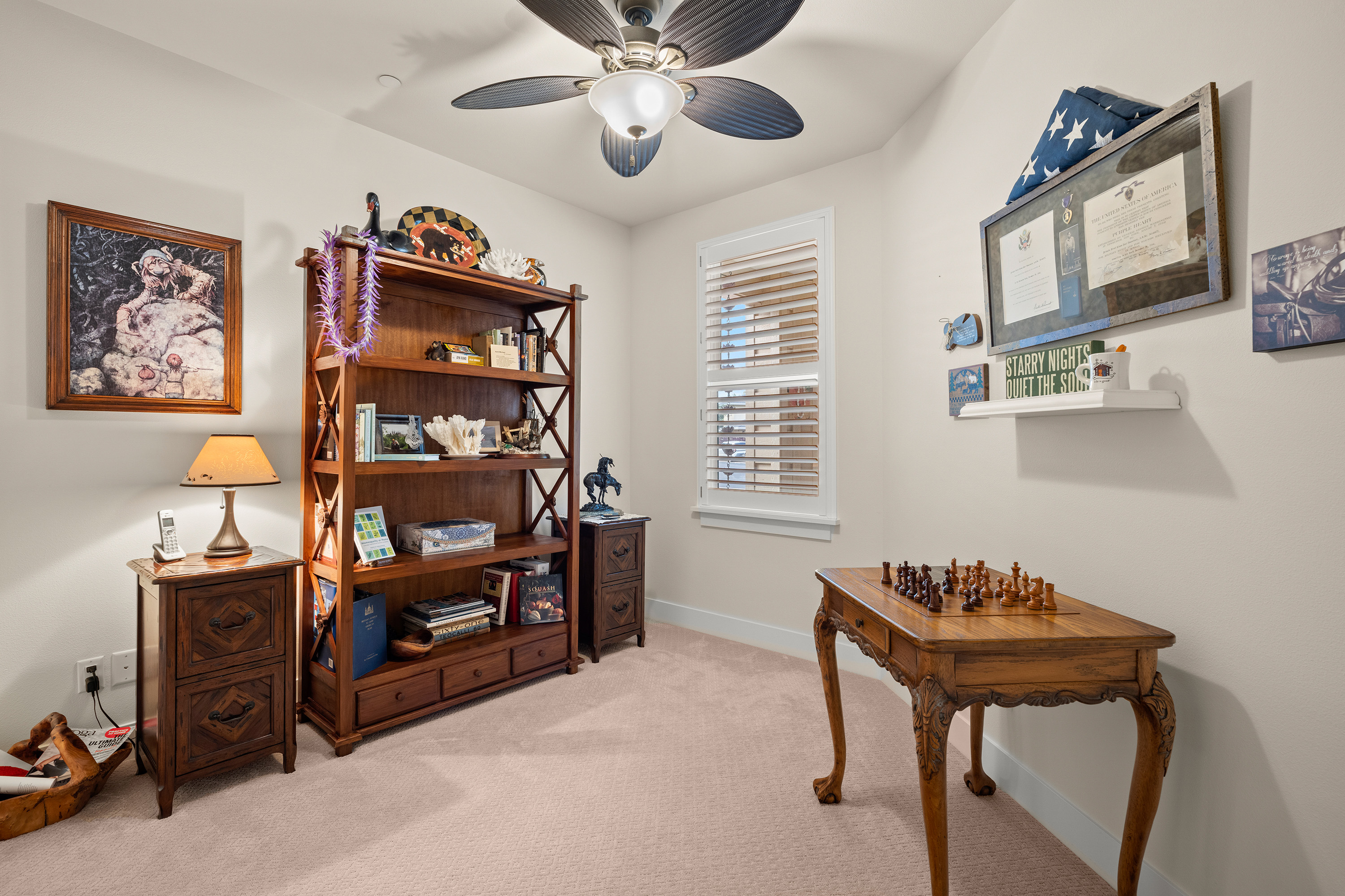 Den with bookshelves and reading corner