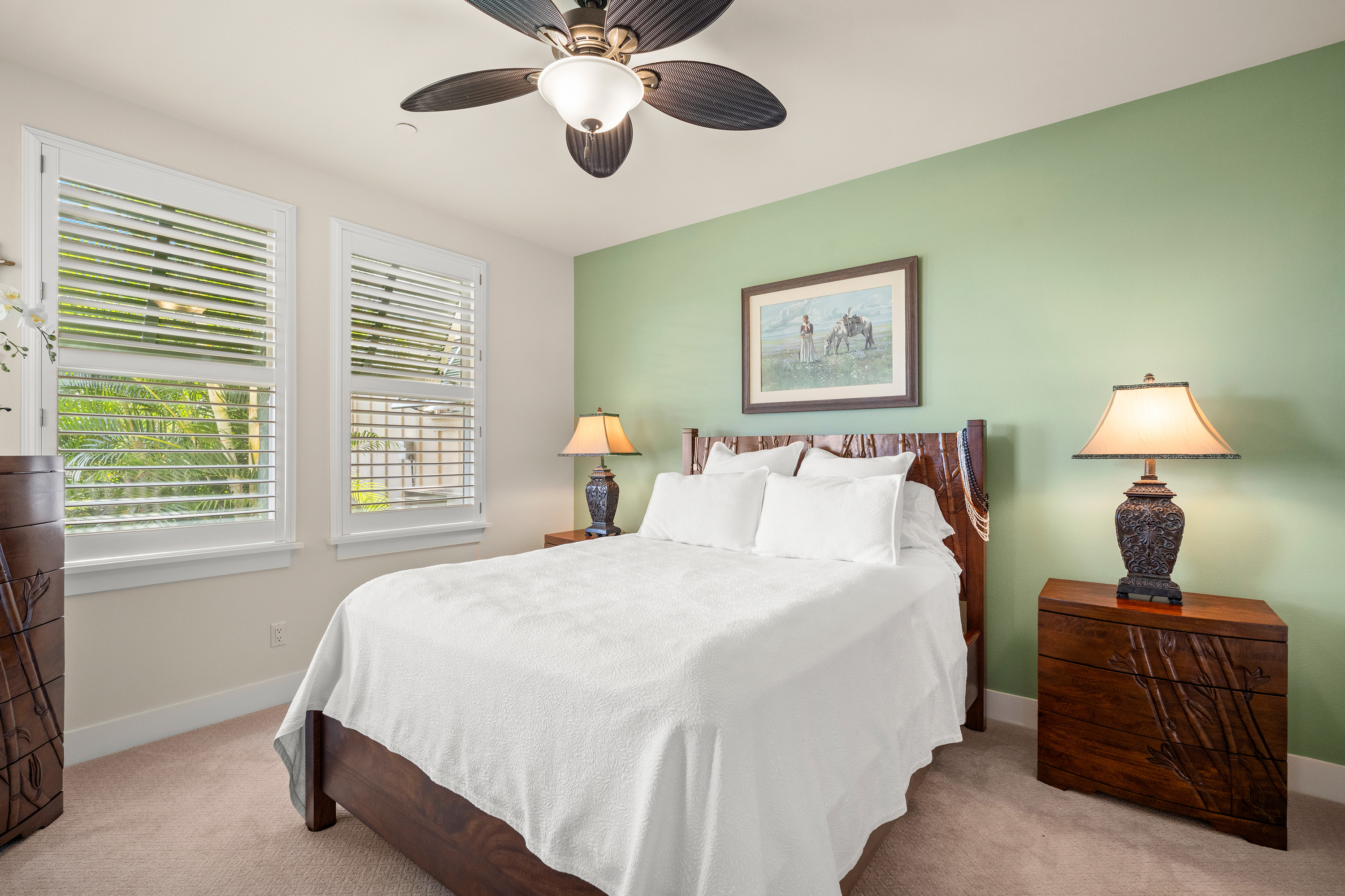 Guest bedroom with green accent wall
